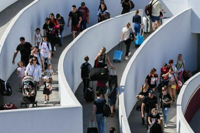 Ukrainian refugees enter the El Chaparral border crossing between Tijuana, Mexico, and San Diego in April 2022. The foreign-born share of the U.S. population, which had been roughly flat since 2017, rose to nearly 14% last year.