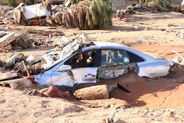 A damaged vehicle is stuck debris after the floods caused by the Storm Daniel ravaged Derna, Libya on September 12.