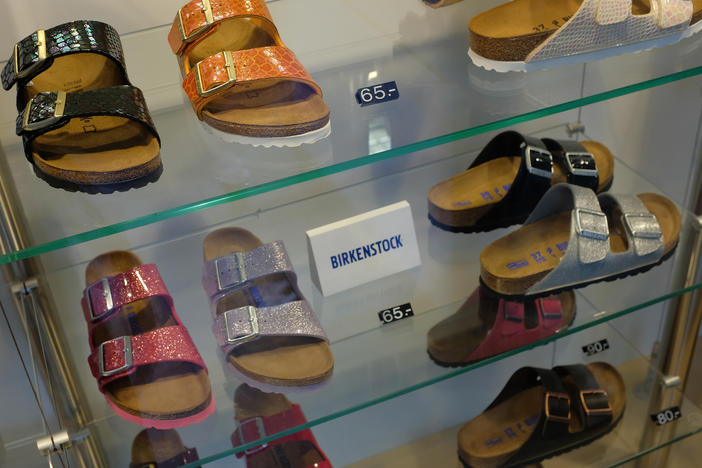 Birkenstock sandals are on display in the window of a store in Berlin.