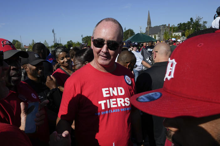 United Auto Workers President Shawn Fain talks with members at a Labor Day parade in Detroit, on Sept. 4, 2023. Fain plans to undertake strategic strikes at Big 3 automaker plants if talks fail on a new contract.