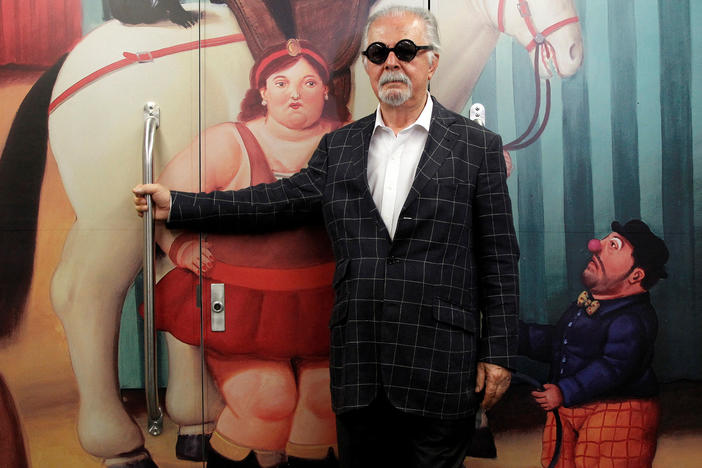 Colombian painter and sculptor Fernando Botero poses inside the "<em>Tren de La Cultura"</em> ("Train of Culture"), during a news conference for the exhibition "Fernando Botero: The Circus," in Medellín, Colombia, Jan. 30, 2015.
