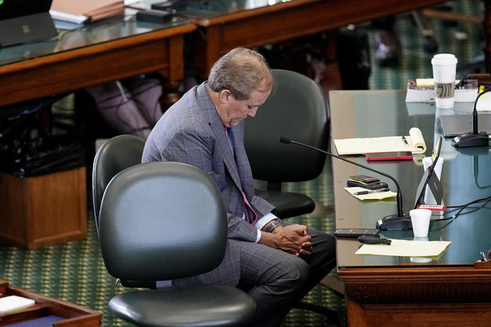 Ken Paxton listens to closing arguments Friday in his impeachment trial in the Texas Senate Chamber in Austin.