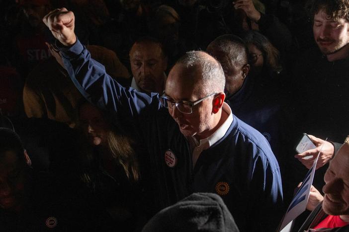 United Auto Workers President Shawn Fain speaks outside the UAW Local 900 headquarters across the street from the Ford Assembly Plant in Wayne, Mich. The union announced the start of a strike at three factories just after midnight on Friday.