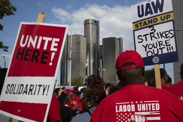 United Auto Workers members attend a solidarity rally in Detroit at the start of the union's strike against Ford, General Motors and Stellantis on Sept. 15. The union is striking against all three automakers at once for the first time ever, but only at targeted plants for now, making it even harder to assess what the strike's economic effects will be.