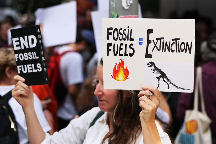 Climate activists participate in a rally outside of the Museum of Modern Art on Friday, Sept. 15, 2023, in New York. Climate activists with Extinction Rebellion NYC organized a rally outside MoMA ahead of this weekend's "March to End Fossil Fuels," calling on the museum to end its partnership with KKR, a private equity firm that has invested nearly $15 billion in fossil fuel projects.