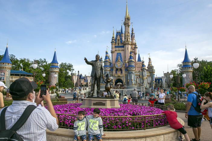 People visit the Magic Kingdom Park at Walt Disney World Resort in Lake Buena Vista, Fla., April 18, 2022.