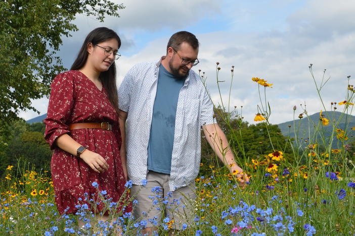 Natalie Gilliard and Jonathan Yacko check out the latest blooms in their lawn-turned-meadow in Vermont