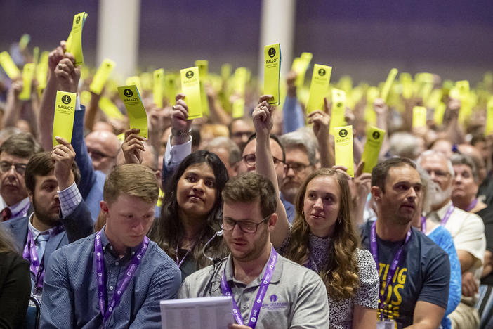 FILE - Delegates hold up their ballots at the Southern Baptist Convention in New Orleans on June 13, 2023. On Tuesday, Sept. 19, 2023, Southern Baptist leaders ousted an Oklahoma church whose pastor defended his blackface performance at one church event and his impersonation of a Native American woman at another.