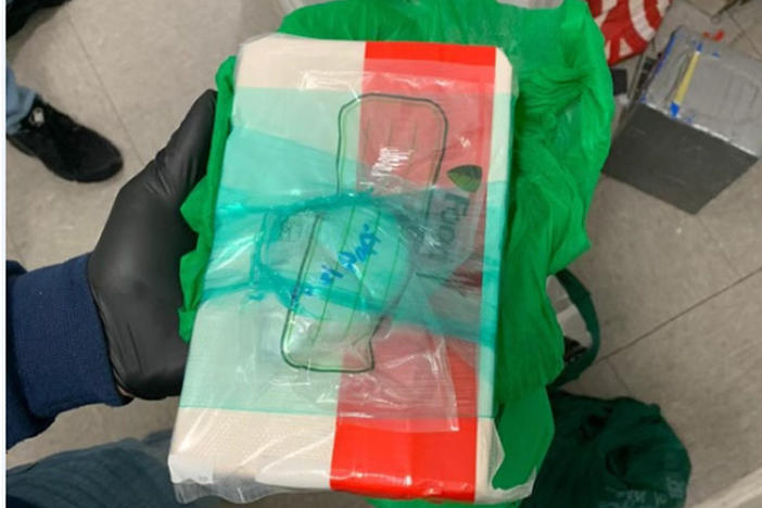 An image from a Drug Enforcement Administration affidavit shows a block of fentanyl and a "kilo press" that authorities say they found at a day care where four young children were apparently poisoned — one fatally.