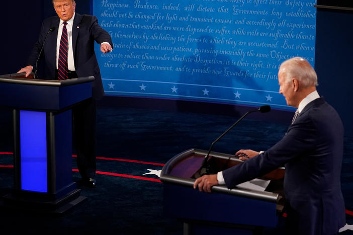 In this file image, then-President Donald Trump and then-former Vice President and Democratic presidential nominee Joe Biden speak during the first presidential debate on Sept. 29, 2020, in Cleveland.