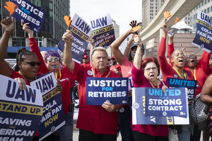 UAW members attend a solidarity rally as the UAW strikes the Big Three automakers on Sept. 15 in Detroit. GM announced temporary layoffs on Wednesday, blaming the strikes.