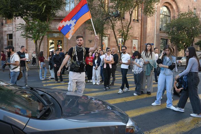Protesters block a street in Yerevan, Armenia's capital, on Wednesday, after a cease-fire was announced between Azerbaijan and ethnic Armenians in the breakaway Nagorno-Karabakh enclave.