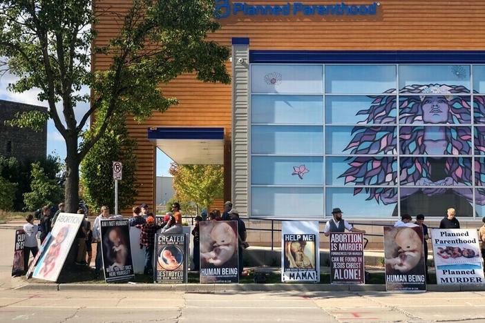Anti-abortion demonstrators gather outside Planned Parenthood's Water Street Health Center in Milwaukee on Monday, Sept. 2023. Planned Parenthood of Wisconsin began offering abortions at the clinic that day after not doing so for more than a year.<em> </em>