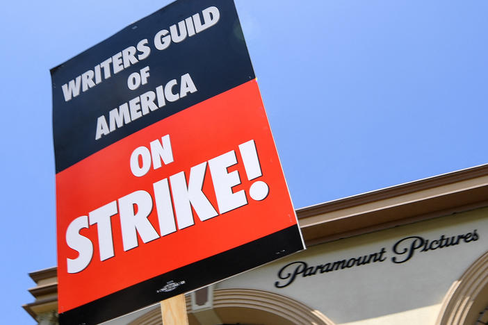 Screenwriters on strike protest in front of Paramount Studios on May 2, 2023 in Los Angeles, Calif.