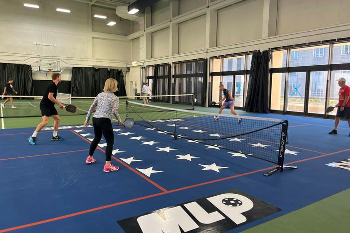 Sens. Shelley Moore Capito, R-W.Va., and Thom Tillis, R-N.C., face off in a game of pickleball in the Dirksen Senate Office Building, along with members of the D.C. professional team.