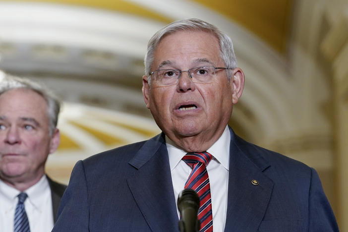 Sen. Bob Menendez, D-N.J., speaks as Sen. Tim Kaine, D-Va., listens during a news conference March 15 on Capitol Hill in Washington.