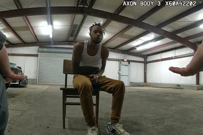 In this image from Baton Rouge Police Department body camera video, officers interact with Jeremy Lee inside a warehouse in Baton Rouge on Jan. 9, 2023. Lee sued the department in August 2023 alleging officers abused him in the police warehouse nicknamed the "Brave Cave."