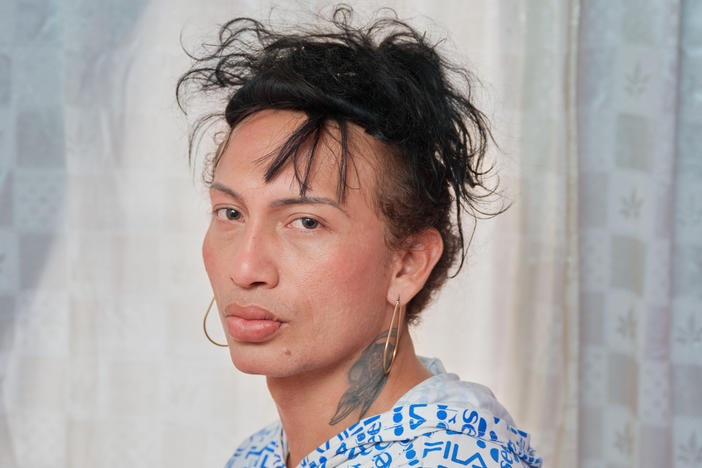 Charloth Chirino poses for a portrait in her apartment in Medellín. Originally from Maracaibo, Venezuela, Charloth has been living in Colombia for seven years, three of those in Medellín. She has lived her life as a proud trans woman since she was 15 years old, when she also began working as a sex worker.