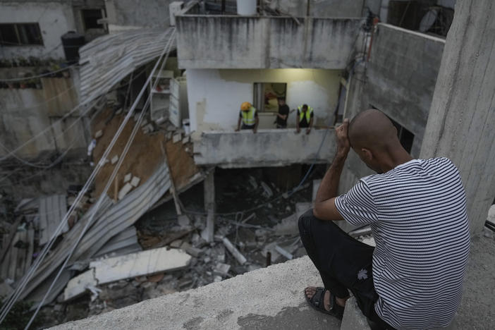 Palestinians inspect a damaged building following an Israeli army raid in Nour Shams refugee camp in the northern West Bank, Sunday, Sept. 24, 2023. Palestinians said at least two people were killed in the raid, which the army said was carried out to destroy a militant command center and bomb-storage facility in the building.