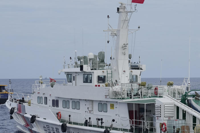 FILE - A Chinese coast guard ship blocks the way of a Philippine supply boat as it heads towards Second Thomas Shoal, locally known as Ayungin Shoal, at the disputed South China Sea on Aug. 22, 2023.