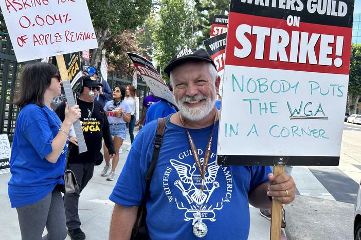 Brian Nelson has been a WGA member for 30 years. On the picket line outside CBS Radford Studios on Friday, The screenwriter said "whatever deal we make may be the template for other deals going forward."