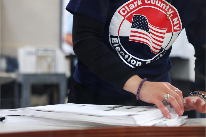 A Clark County Election Department worker sorts ballots on Nov. 9, 2022, in North Las Vegas, Nev. Nearly 60% of the state's county voting officials are new since 2020, according to a new report.