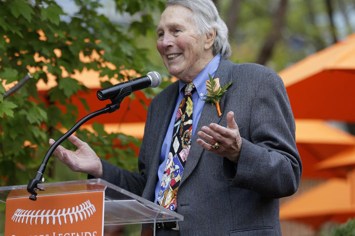 Former Baltimore Orioles third baseman Brooks Robinson speaks during a ceremony to unveil a statue of him in Baltimore on Sept. 29, 2012. Robinson, whose deft glovework and folksy manner made him one of the most beloved and accomplished athletes in Baltimore history, has died.