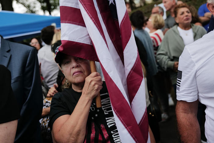 Staten Island residents protest outside a closed Catholic school-turned-migrant shelter on Staten Island, N.Y., on Aug. 28.