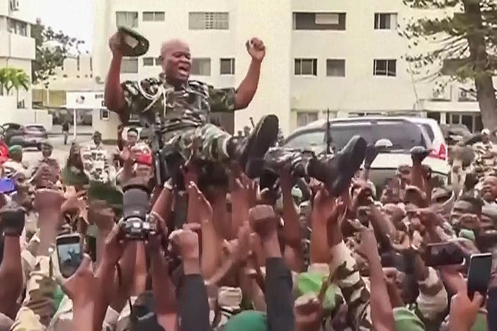This video grab shows soldiers holding General Brice Clotaire Oligui Nguema aloft in Libreville, Gabon, on Aug. 30, 2023.