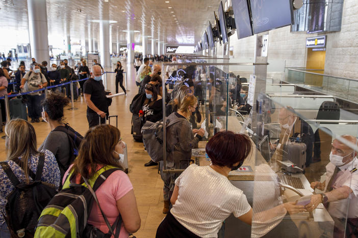 Passengers at the check-in desks in the departures hall at Ben Gurion International airport in Tel Aviv, Israel, on Nov. 30, 2021.
