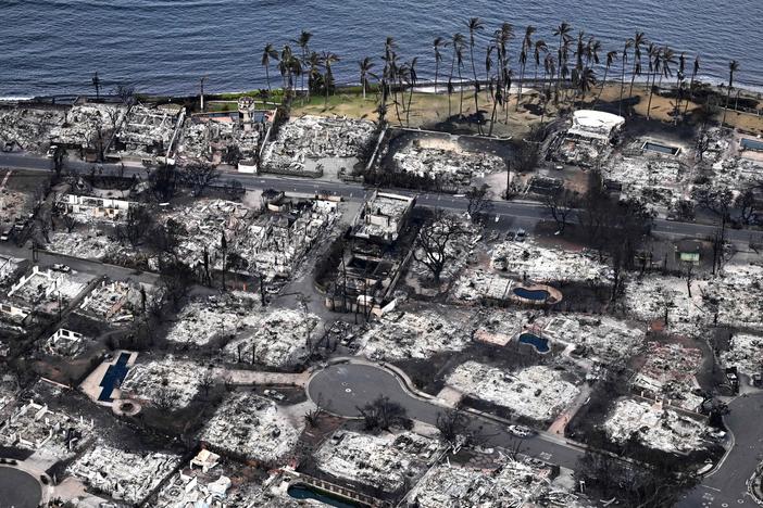 An aerial image taken on Aug. 10, 2023 shows destroyed homes and buildings burned to the ground in Lahaina in the aftermath of wildfires in western Maui, Hawaii. Rumors and conspiracy theories quickly flourished after the fire, hampering relief efforts.