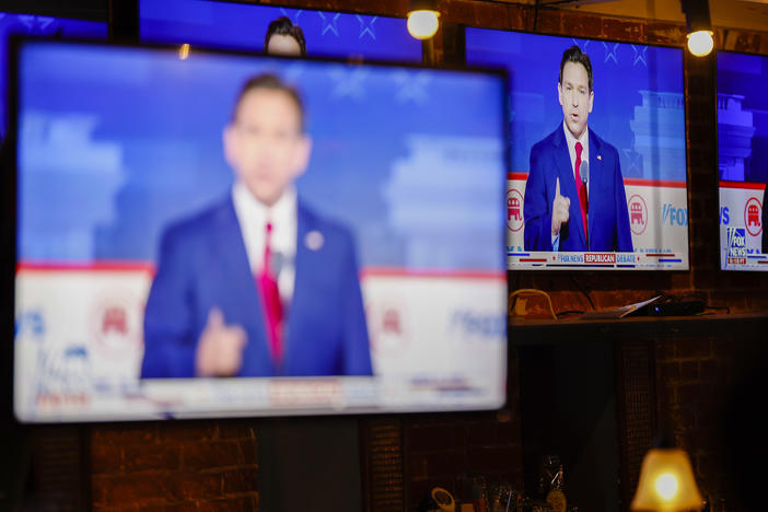 Republican presidential candidate and Florida Gov. Ron DeSantis is displayed on television screens at a watch party for the first 2024 Republican presidential primary debate on August 23 in Washington.