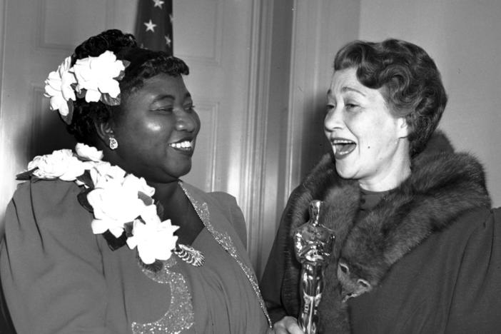 Actress Hattie McDaniel, left, appears with actress Fay Bainter, right, the night McDaniel won best supporting actress for her role in the 1939 film <em>Gone With the Wind</em> in Los Angeles on Feb. 29, 1940. The Academy of Motion Pictures Arts and Sciences has created a replacement of McDaniel's Academy Award plaque that it is gifting to Howard University.