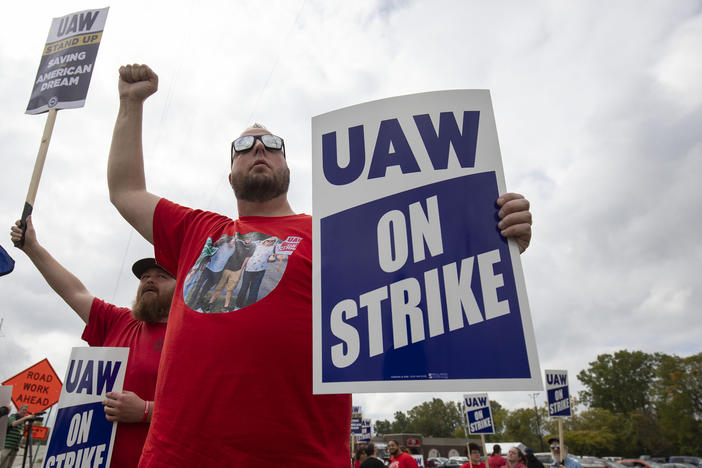 UAW members strike at GM's Lansing-Delta Assembly Plant in Lansing, Mich., on Sept. 29, 2023. The UAW on Friday expanded its strike against GM and Ford, but not Stellantis.