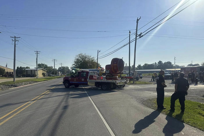 Emergency responders work the scene of semitruck crash in Teutopolis, Ill., on Saturday. Federal regulators confirmed they are reviewing the crash of a semitruck carrying a toxic substance in central Illinois, resulting in "multiple fatalities" and dangerous air conditions that prompted the evacuation of area residents.