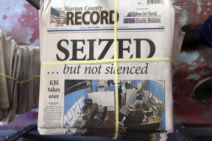 A stack of the Marion County Record sits in the back of the newspaper's building, awaiting unbundling, sorting and distribution on Aug. 16, 2023, in Marion, Kan.