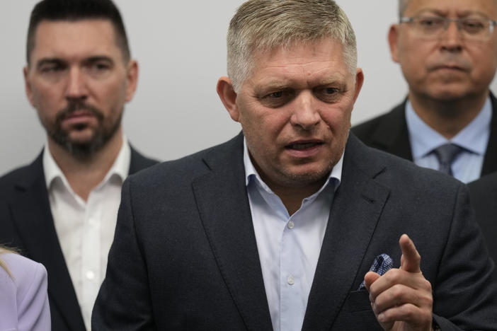 Chairman of Smer party Robert Fico (center) addresses reporters in Bratislava, Slovakia, on Sunday.