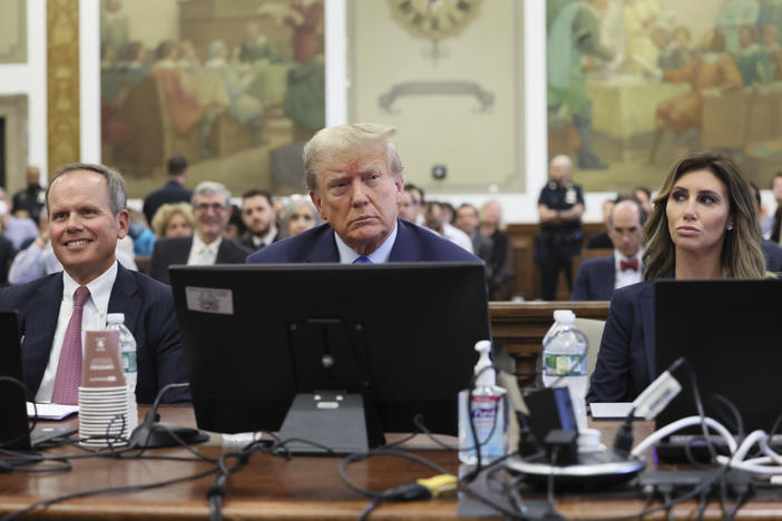 Former President Donald Trump (center) appears in court Monday in New York.