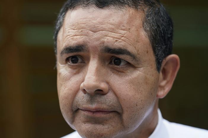 U.S. Rep. Henry Cuellar, D-Texas, is shown talking to a member of the media during a campaign event in San Antonio, May 4, 2022.