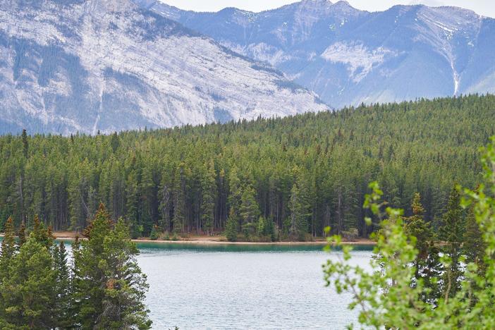 Visitors canoe on Lake Minnewanka in Banff National Park in Banff, Alberta, Canada, on May 23, 2023.