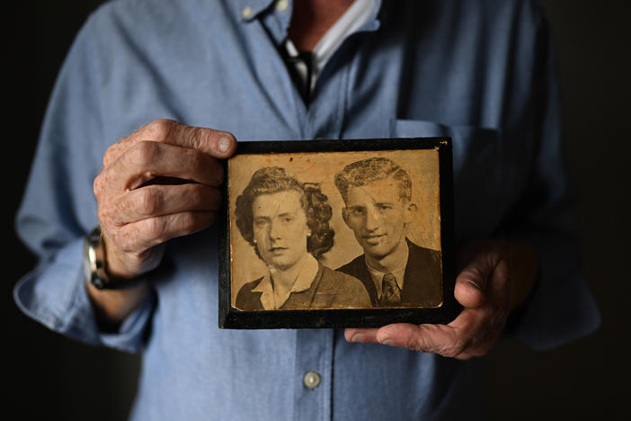 Paul Crawford holds a photograph of his mother and father at his home in Glenavy. His father John Crawford was shot dead in 1974 in front of the West Belfast furniture factory he ran.