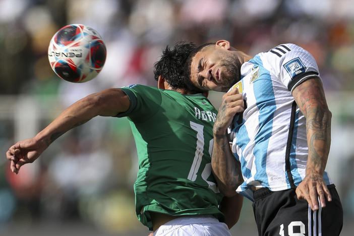 Argentina's Nicolás Otamendi goes for a header with Bolivia's Victor Ábrego during a qualifying match for the FIFA World Cup 2026 at Hernando Siles stadium in La Paz, Bolivia, on Sept. 12.
