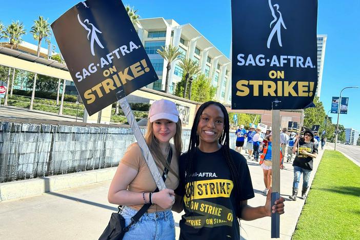 Outside Fox studios in Los Angeles, production assistant Allie Palm and SAG-AFTRA actress Desiree Woolfolk say they can't wait to get back to work.