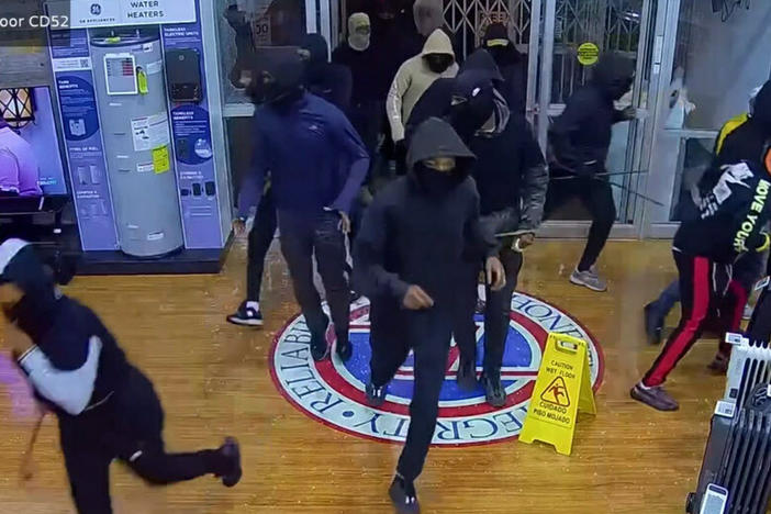 An image from security camera footage shows alleged thieves breaking into a P.C. Richard & Son appliance store in Philadelphia in late September.