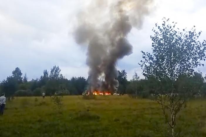 In this image taken from video, smoke rises from the crash of a private jet near the village of Kuzhenkino in the Tver region of Russia, on Aug. 23. Mercenary leader Yevgeny Prigozhin, head of the Wagner Group, and his top lieutenants were among the 10 people killed in the crash northwest of the Russian capital.