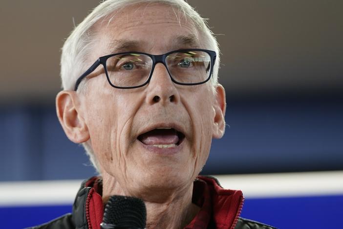 Wisconsin Democratic Gov. Tony Evers speaks at a campaign stop in October 2022, in Milwaukee. A man illegally brought a handgun into the Wisconsin Capitol on Wednesday demanding to see the governor then returned later with an assault rifle after posting bail.