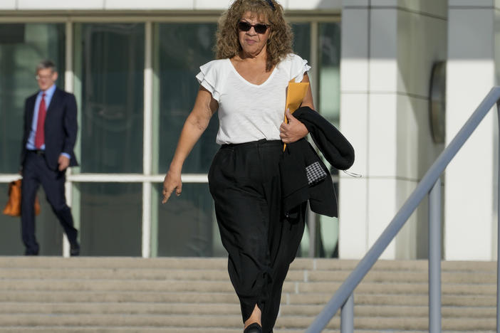 Nancy Marks leaves federal court, Thursday, Oct. 5, 2023, in Central Islip, N.Y. Marks, the ex-campaign treasurer for U.S. Rep. George Santos pleaded guilty Thursday to conspiring to defraud the U.S. government and implicated the indicted New York Republican in court with submitting bogus campaign finance reports. (AP Photo/Mary Altaffer)