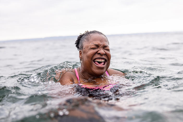 Mikki Smith lets out a cry as she adjusts to the frigid water. It was her first time with the Puget Sound Plungers in Seattle, Washington.