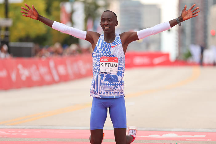 Kelvin Kiptum of Kenya celebrates after winning the 2023 Chicago Marathon professional men's division and setting a world record marathon time of 2:00.35 at Grant Park on Sunday in Chicago, Illinois.
