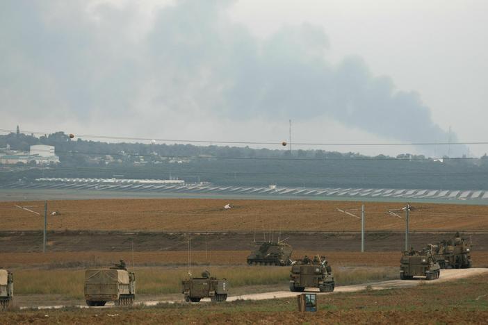 Israeli troop reinforcements take position at the border with Gaza in southern Israel on Monday. Social media and messaging apps have been flooded with false and out of context images since fighting started this weekend.